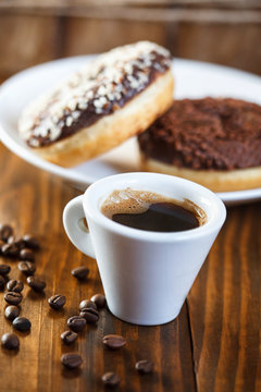 mug coffee with sugar glazed donuts 