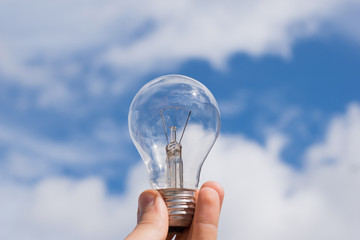 LIght bulb in hand eco renewable energy