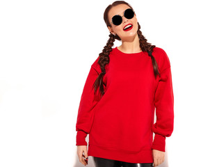 Portrait of young happy smiling woman model with bright makeup and colorful lips with two horns and sunglasses in summer red clothes isolated on white. Going crazy