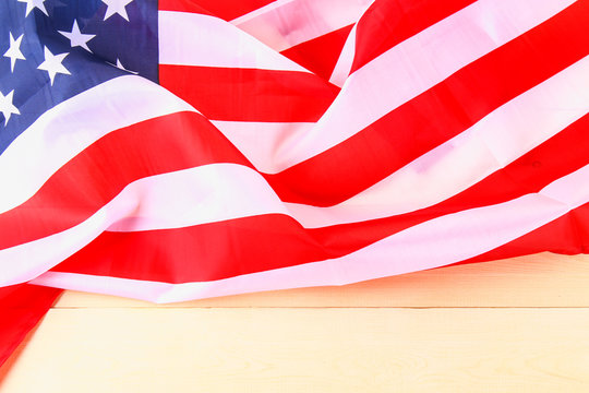 American Flag Over Whitewashed Wood Background For United States Holidays.