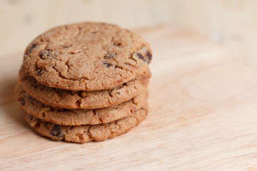 Cookies are stacked on a wooden table