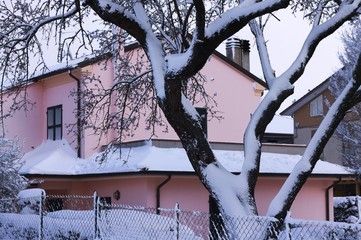 Pink house behind a snowy fence (Pesaro, Italy)