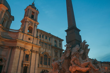 Italian Piazza Navona with Fountain of the Four Rivers and Sant Agnese church in Rome outdoors