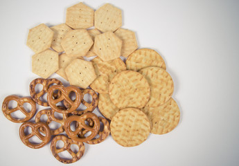 Mix of snacks : pretzels, crackers, cookies.
