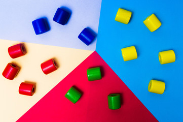 Colorful marshmallows on pastel colored background