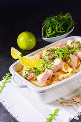 Salmon with penne noodle and arugula