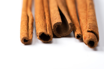 Cinnamon on white background, top view