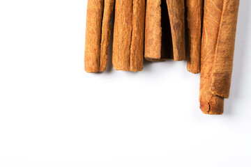 Cinnamon on white background, top view