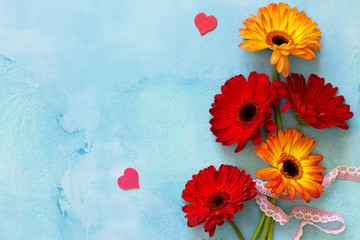 Mother's Day background or greeting card. Bouquet Flowers of gerbera on a stone background or slate with copy space.