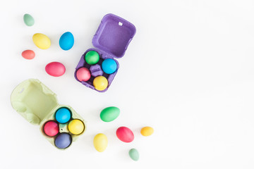 Easter eggs on white background. Easter concept. Flat lay, top view, copy space