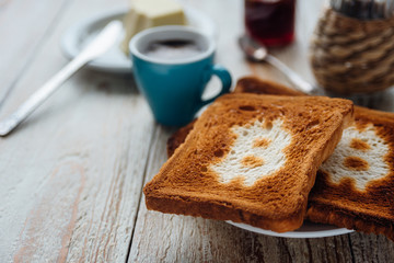 Breakfast of businessman with coffee and toasts