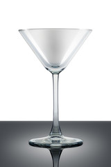 Empty martini glass isolated on white background