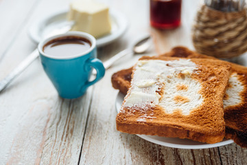Breakfast of businessman with coffee and toasts