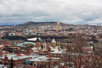 Fototapeta premium Panoramic view of Tbilisi, the capital of Georgia with old town and modern architecture