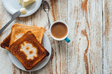 Breakfast of businessman with coffee and toasts