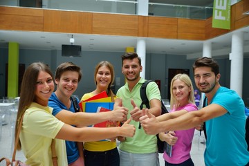 Happy group of students with thumbs up