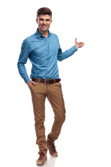 smiling young casual man presenting
