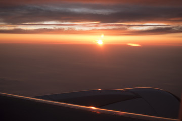 Fototapeta na wymiar Beautiful sunset from airplain in the sky