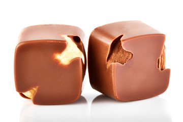 Assortment of chocolate candies sweets isolated on a white background. Chocolate candies collection. Milk chocolate with nuts.