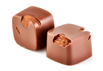 Assortment of chocolate candies sweets isolated on a white background. Chocolate candies collection. Milk chocolate with nuts.