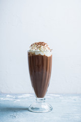 Chocolate milkshake on the rustic background. Selective focus.