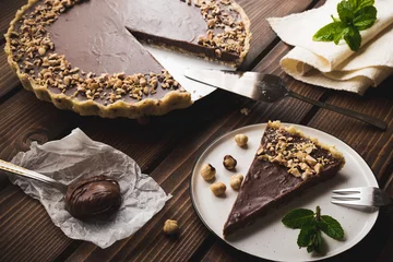 Selbstklebende Fototapeten Nutella, hazelnut tart. Chocolate dessert. © bradaricpublic