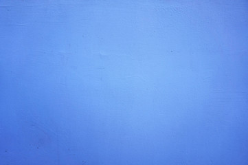 texture of the wall painted blue with darkened corners