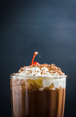 Chocolate milkshake on the rustic background. Selective focus.