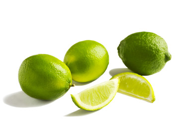 Fresh limes isolated on white background