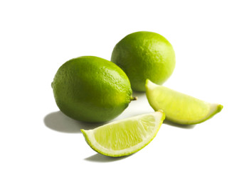 Fresh limes isolated on white background