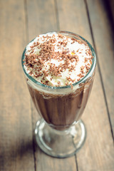Chocolate milkshake on the rustic background. Selective focus.