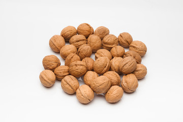 A group of whole walnut on white background