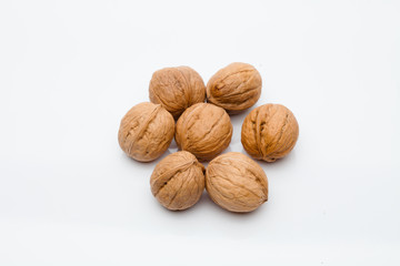 A group of whole walnut on white background