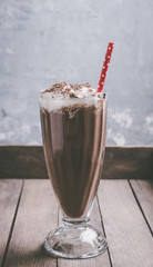 Chocolate milkshake on the rustic background. Selective focus.