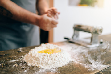 Homemade pasta cooking, male chef preparing dough