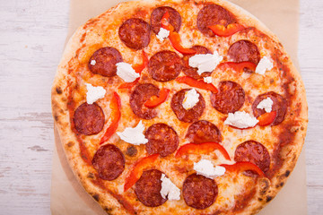 Salami and feta cheese and red pepper pizza