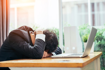Fototapeta premium Asian businessman man depressed because he was in trouble in the business he is handle in progress.