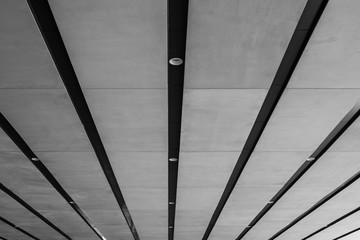 Abstract black and white image line of architecture ceiling at underground of modern buildings. (Selective focus)