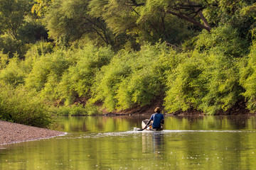 Fisherman on the Gambia River near Niokolo-Koba National Park in Senegal, West Africa