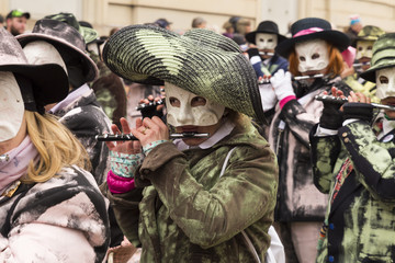 Steinenberg, Basel, Switzerland - February 19th, 2018. Close-up of carnival participants playing...