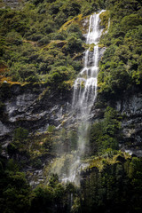 Fototapeta na wymiar Waterfalls in Milford Sound, New Zealand