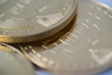 several gold bitcoin closeup, blurred photo. electronic money