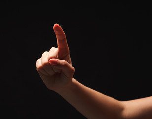 Hand gestures - woman pointing, isolated at black
