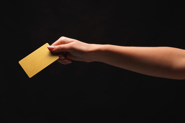 Closeup of female hand holding blank plastic card