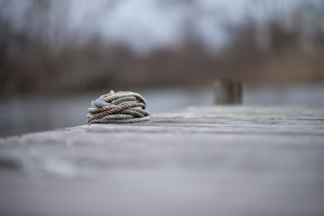 Boat dock rope , bokeh 