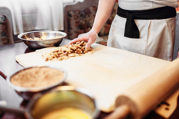 Fototapeta na wymiar Chef cooking strudel, pastry ingredients