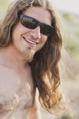 Attractive man with sunglasses in outdoors portrait