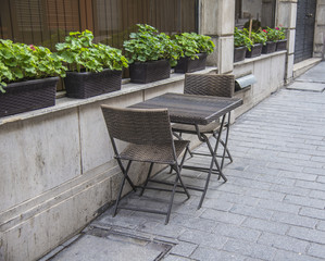 Empty tables and chairs outside of the restaurant in old city