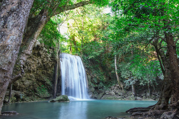 Fototapeta na wymiar Erawan waterfall with beautiful in the Kanchanaburi Province, Thailand.
