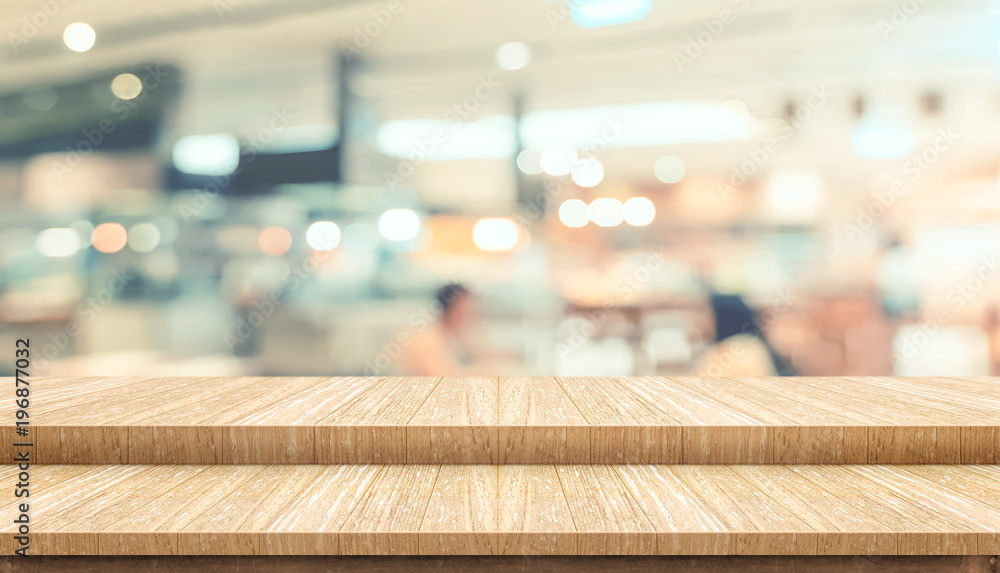 Poster empty step plank wood table top food stand with blur cafe restaurant background bokeh light,mock up 
